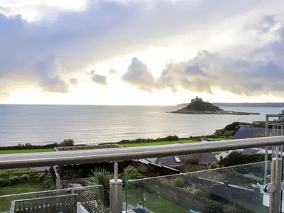 a view of the ocean from the balcony of a house at Ty Bryn in Marazion