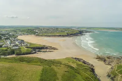 an aerial view of a beach and the ocean at 5 The Sands in Polzeath