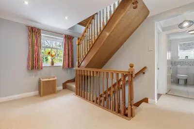 a home with a staircase and a toilet at Trenaton in Padstow