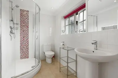a bathroom with a sink and a toilet and a shower at Trenaton in Padstow