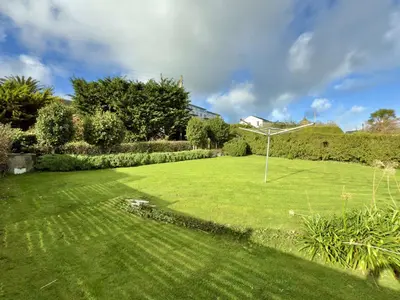 a large grassy yard with a goal in the middle at Gwel Teg, 30 Egerton Road in Padstow