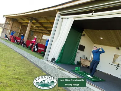 a man standing inside of a garage at Boskilly in St Merryn