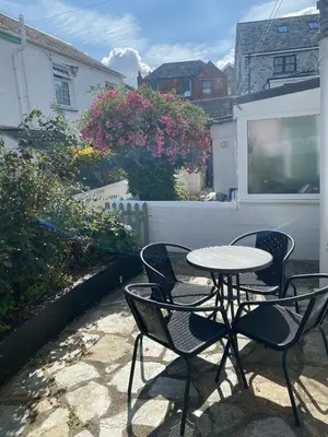 a table and chairs sitting on a patio at Little Penty in Padstow