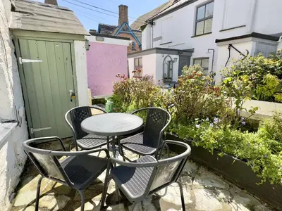 a table and chairs sitting on a patio at Little Penty in Padstow