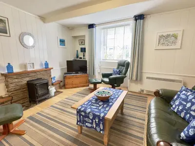 a living room with a couch and a coffee table at Little Penty in Padstow