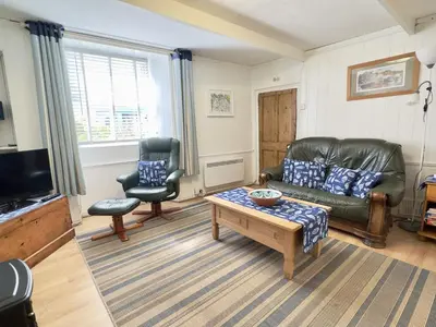 a living room with a couch and a coffee table at Little Penty in Padstow