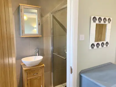 a bathroom with a sink and a shower at Morwennol in St Merryn
