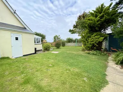 a yard with a house and a tree at Treaaron in St Merryn