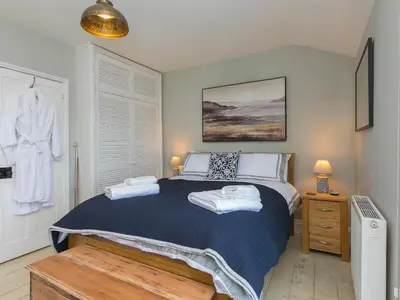 a bedroom with a bed with towels on it at St Ives View in St Ives
