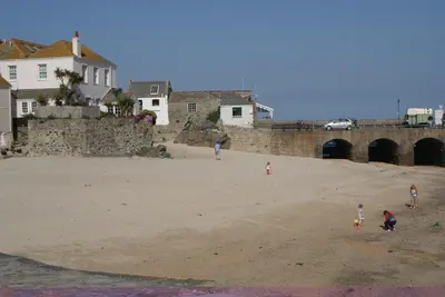 a group of children playing on the beach at Grey Mullet Guest House in St Ives