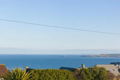 a view of the ocean from a city at Oystercatcher House in St Ives