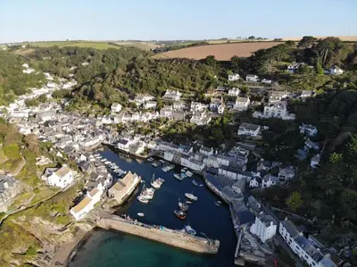 an aerial view of a harbor with boats in the water at Fishermans Heights in Polperro