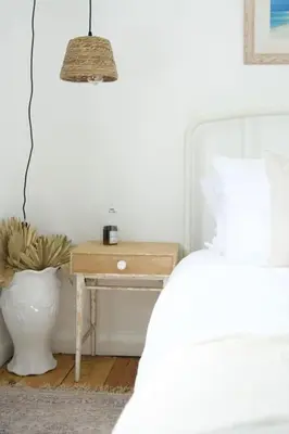 a bedroom with a bed and a table with a lamp at The Palm House Falmouth - minutes from the beach! in Falmouth