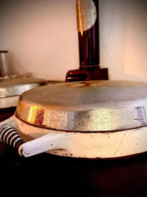 a metal object sitting on top of a table at The White House at The Tinners Arms in St Ives