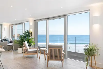 a living room with a view of the ocean at Shore Edge in Portreath
