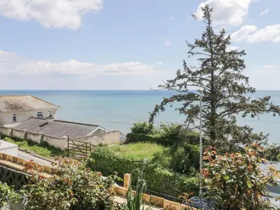a view of the ocean from the garden at Raven Cottage in Torpoint
