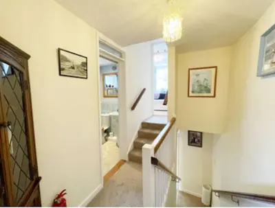 a staircase in a home with a stair case at Waypast, Port Isaac Bay Holidays in Port Isaac
