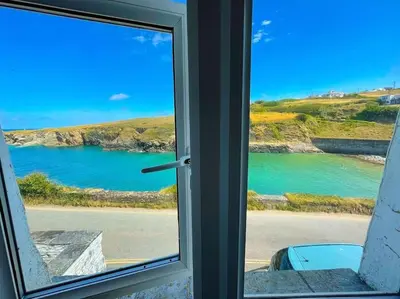 a window with a view of a body of water at The Rockies, Port Isaac Bay Holidays in Port Isaac