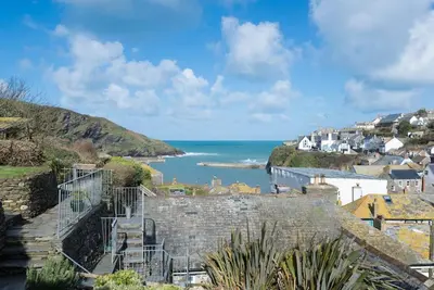 a view of the ocean from a coastal town at Scuppers, Port Isaac Bay Holidays in Port Isaac