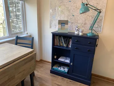 a blue dresser with a lamp and a desk at 1 bed-Pet Friendly-Parking-Patio-close to coasts in North Hill