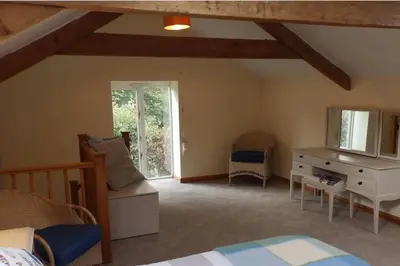 a bedroom with a bed and a dresser and a window at 1 bed-Pet Friendly-Parking-Patio-close to coasts in North Hill