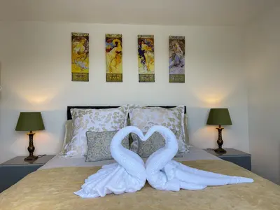 two swans making a heart on a bed at The View in Bodmin