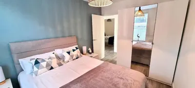 a bedroom with a large bed in a room at Parkside in Perranporth