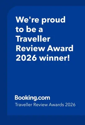 a blue sign that says were proud to be a traveler review award winner at Curlews Cottage - House with 3 bedrooms and garden - walking distance to the beach in Perranporth