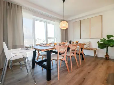 a dining room with a table and chairs at 33 Cliff Edge in Newquay