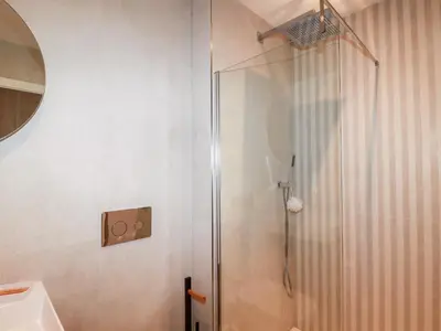 a shower with a glass door in a bathroom at 33 Cliff Edge in Newquay