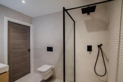 a bathroom with a shower and a toilet at 7 Cliff Edge in Newquay
