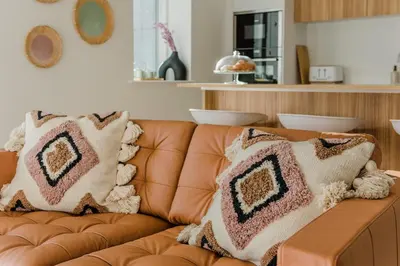 a couch with pillows on it in a living room at 7 Cliff Edge in Newquay