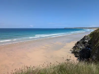 a sandy beach with the ocean in the background at A18 Bojago, Riviere Towans in Hayle