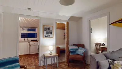 a living room with a couch and a bed in a room at A18 Bojago, Riviere Towans in Hayle