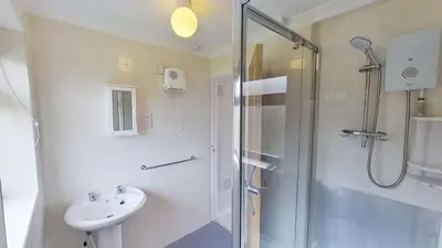 a bathroom with a shower and a sink at B04 Beachcroft B4, Riviere Towans in Hayle