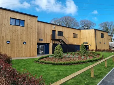 a building with a garden in front of it at Bungalow 62,North Cornwall, St. Tudy in Saint Tudy