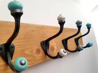 a wooden object with four wooden knobs on it at Bracken's Retreat in Lostwithiel