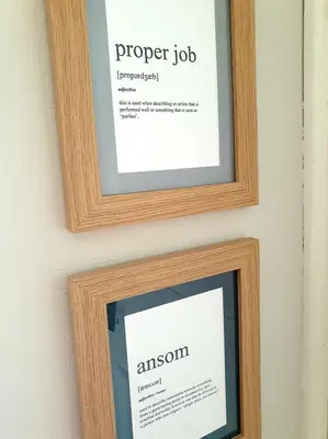 two picture frames on a wall with a paper job at Bracken's Retreat in Lostwithiel