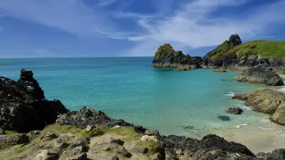 a view of the ocean from a rocky beach at Central Falmouth Flat with Free Parking in Falmouth
