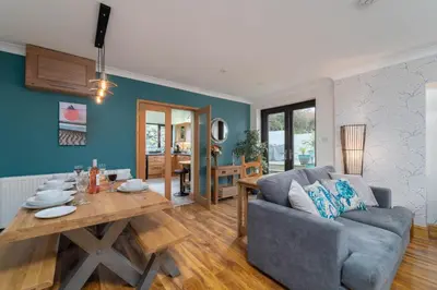 a living room with a couch and a table at Trevelyan in St Ives