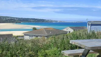 a view of the beach from a picnic table at B44 Sea Urchin, Riviere Towans in Hayle