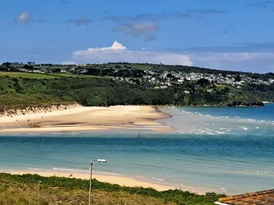 a view of a beach with a town in the background at B44 Sea Urchin, Riviere Towans in Hayle