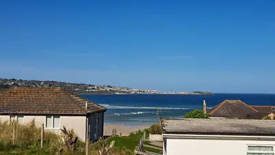 a view of the ocean from a house at B52 Oyster, Riviere Towans in Hayle