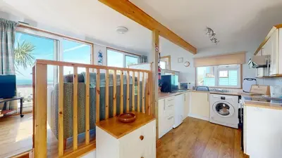 a kitchen with a counter and a stove top oven at C23 Wilmar, Riviere Towans in Hayle