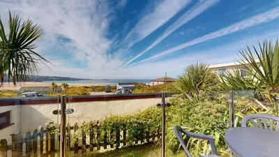 a balcony with a view of the ocean at C23 Wilmar, Riviere Towans in Hayle