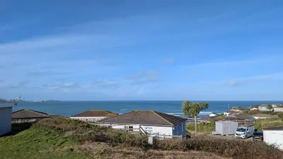 a view of the ocean from a house at C24 Rosemary, Riviere Towans in Hayle