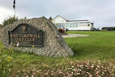 a sign for a west cornwall golf club in a field at Sandy Bay Apartment, St Ives Bay, Hayle in Hayle