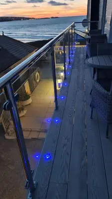 a deck on a cruise ship with blue lights at Sandy Bay Apartment, St Ives Bay, Hayle in Hayle