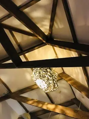 a chandelier hanging from the ceiling of a room at UNIQUE CORNISH COTTAGE CONVERSION Central location in Redruth