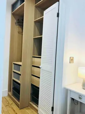 a closet with a white door and a desk at UNIQUE CORNISH COTTAGE CONVERSION Central location in Redruth